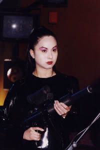 One of the most beautiful, but deadly Japanese Yakuza, well armed with silenced 9mm H+K MP5 SD