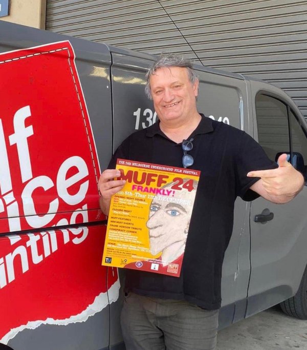 Richard Wolstencroft holding a MUFF 24 poster